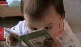 Baby reading with crazy eyes